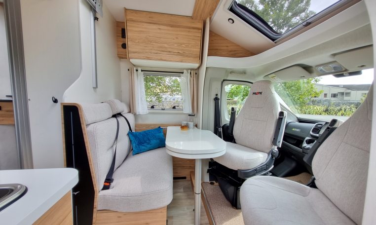 2025 Fiat Ducato Pilote P650C motorhome interior view showing the front dinette.