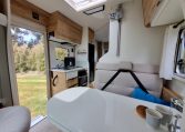 2025 Fiat Ducato Pilote P650C motorhome interior view showing the front dinette blinds.
