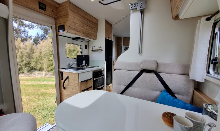 2025 Fiat Ducato Pilote P650C motorhome interior view showing the front dinette blinds.