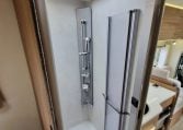 Fiat Ducato Pilote P740FC motorhome interior view showcasing the shower head in the shower.