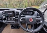 Fiat Ducato Pilote P740FC motorhome interior view showcasing the steering wheel and dash.
