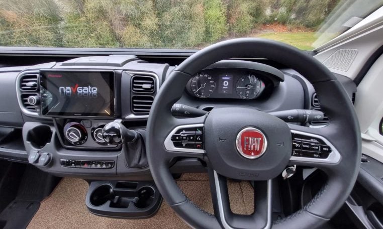 Fiat Ducato Pilote P740FC motorhome interior view showcasing the steering wheel and dash.