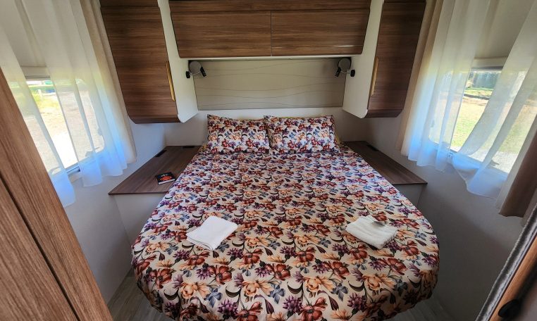 2025 Fiat Ducato Pilote P746FC interior view showing the rear island bed.