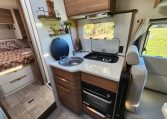 2025 Fiat Ducato Pilote P746FC interior view showing the compact motorhome kitchen setup.