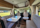 2025 Fiat Ducato Pilote P746FC interior view showing the spacious motorhome lounge and dining area.
