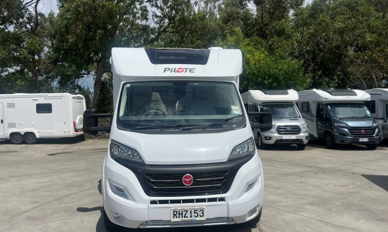 Front view of a 2025 Pilote 650GJ motorhome showing the cab and sleek exterior design.