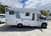 Side view of a 2025 Pilote 650GJ motorhome showing the habitation door and camper exterior.