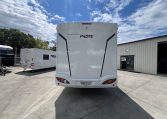 Rear view of the 2025 Pilote 650GJ motorhome displaying overall back profile and exterior details.