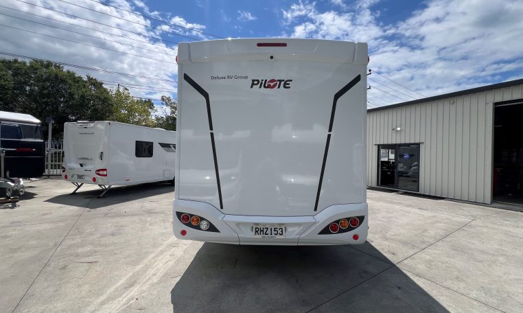 Rear view of the 2025 Pilote 650GJ motorhome displaying overall back profile and exterior details.