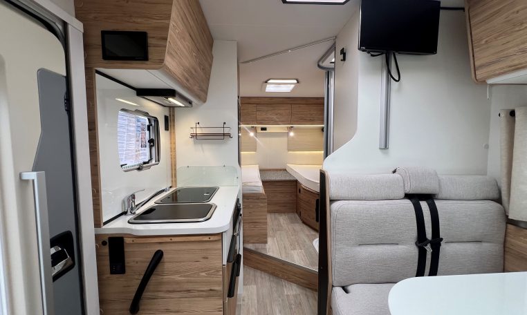 TV mounted inside the 2025 Pilote 650GJ motorhome living area.