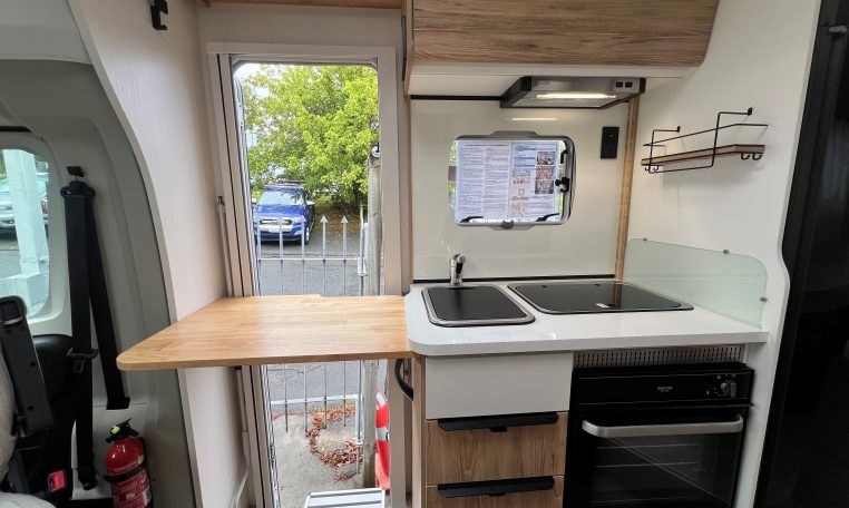 Kitchen bench extension in a 2025 Pilote 650GJ for extra workspace.