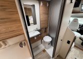 Compact motorhome toilet in the 2025 Pilote 650GJ with modern fittings and a clean, practical bathroom layout.