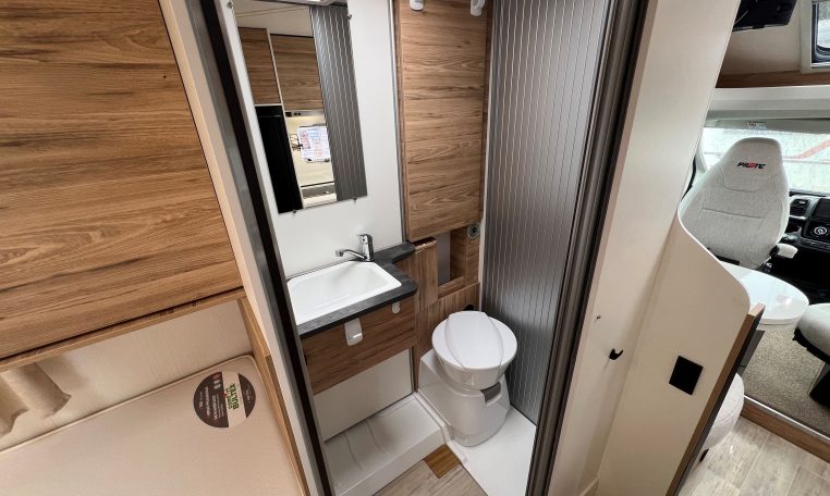 Compact motorhome toilet in the 2025 Pilote 650GJ with modern fittings and a clean, practical bathroom layout.