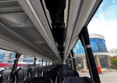 Overhead speakers in a BCI Volvo B13R bus providing audio announcements and entertainment for passengers.