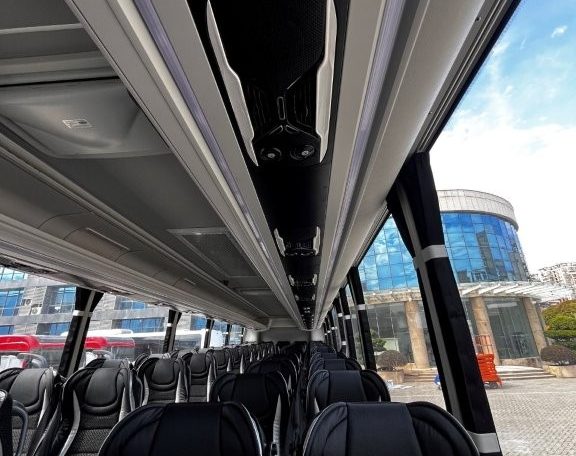Overhead speakers in a BCI Volvo B13R bus providing audio announcements and entertainment for passengers.