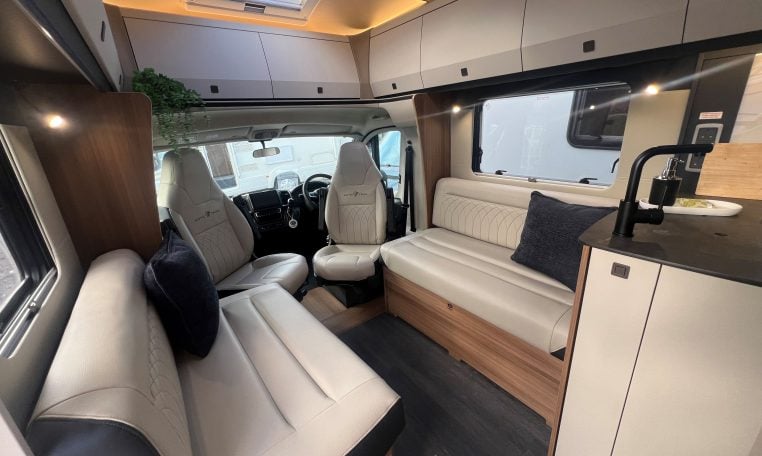 2026 Auto-Trail Frontier Delaware motorhome interior view of the front lounge and overhead cabinets for extra storage.