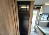 2026 Auto-Trail Frontier Delaware motorhome interior view showing the integrated microwave and fridge.
