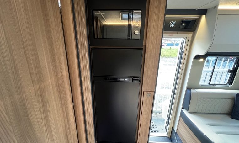 2026 Auto-Trail Frontier Delaware motorhome interior view showing the integrated microwave and fridge.