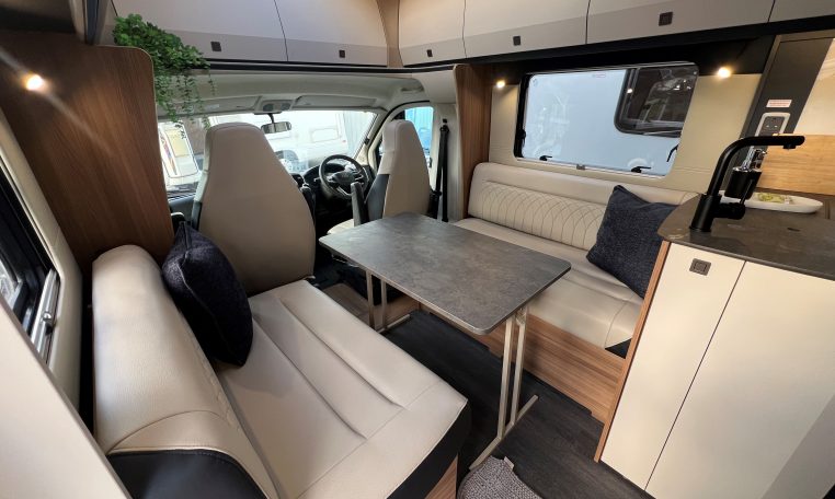 2026 Auto-Trail Frontier Delaware motorhome interior view of the front lounge and dining table.