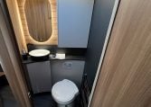 2026 Auto-Trail Frontier Delaware motorhome interior view of the bathroom with toilet and handbasin setup.