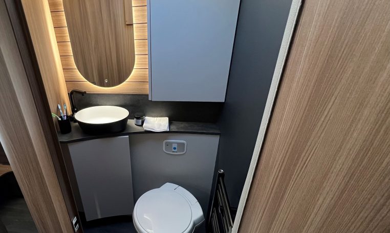 2026 Auto-Trail Frontier Delaware motorhome interior view of the bathroom with toilet and handbasin setup.