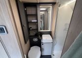 2026 Auto-Trail F-Line F62 motorhome interior showing the bathroom with toilet, shower and handbasin.
