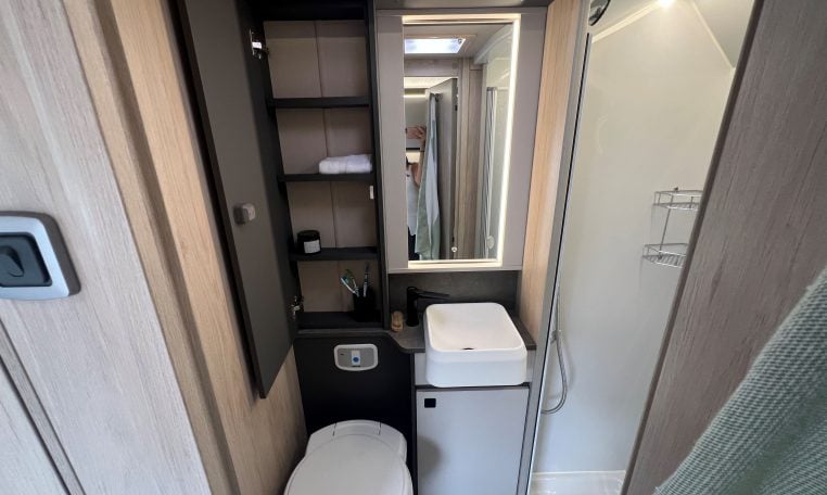 2026 Auto-Trail F-Line F62 motorhome interior showing the bathroom with toilet, shower and handbasin.