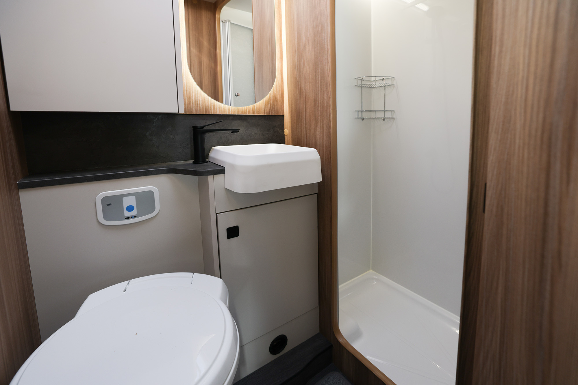 Spacious bathroom inside the Auto-Trail Imala 736 motorhome, featuring modern fittings and bright lighting.