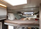 2026 Roller Team T-Line 700 interior view showing the handles on the drop-down bed.