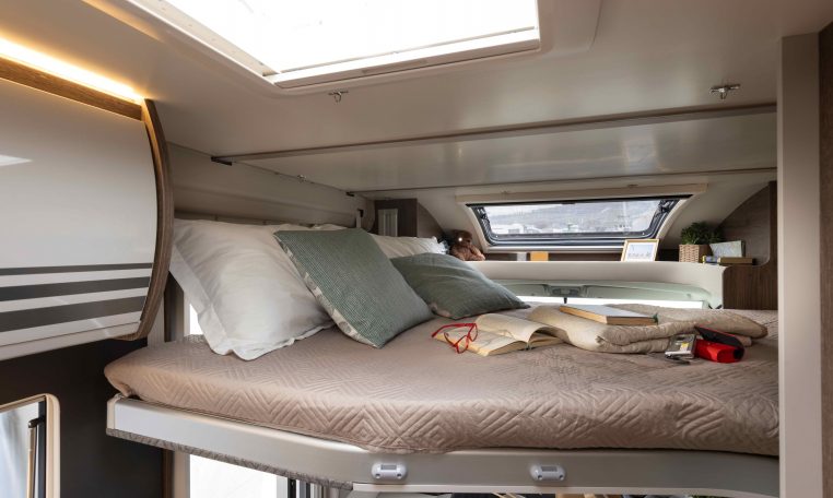 2026 Roller Team T-Line 700 interior view showing the handles on the drop-down bed.