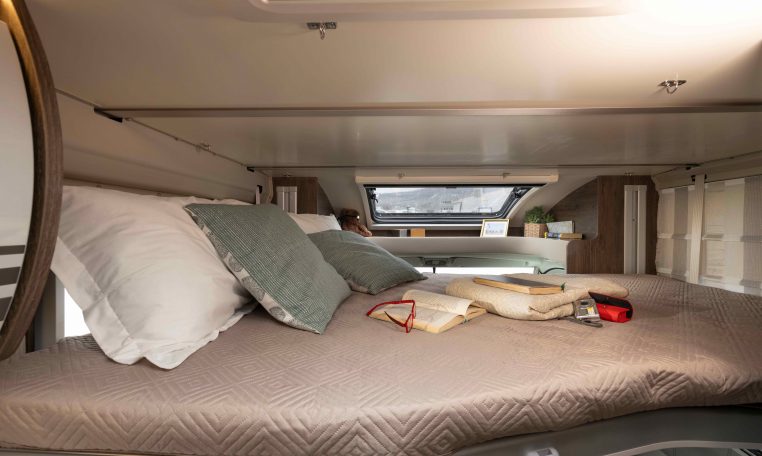 2026 Roller Team T-Line 700 interior view showing the skylight above the drop-down bed.