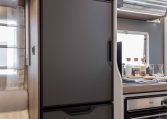 2026 Roller Team T-Line 700 interior view showing the built-in fridge.