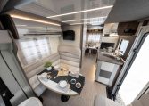 2026 Roller Team T-Line 700 interior view showing the front dining overhead storage.