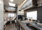 2026 Roller Team T-Line 700 interior view showing the kitchen overhead storage.