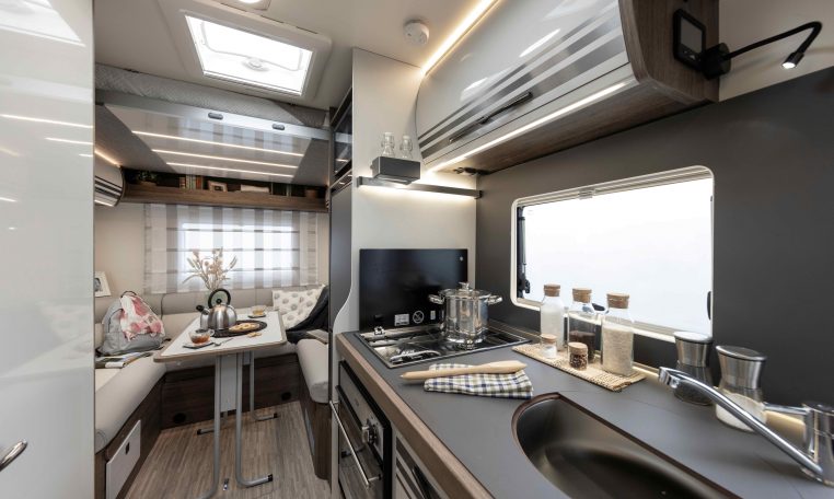 2026 Roller Team T-Line 700 interior view showing the kitchen overhead storage.