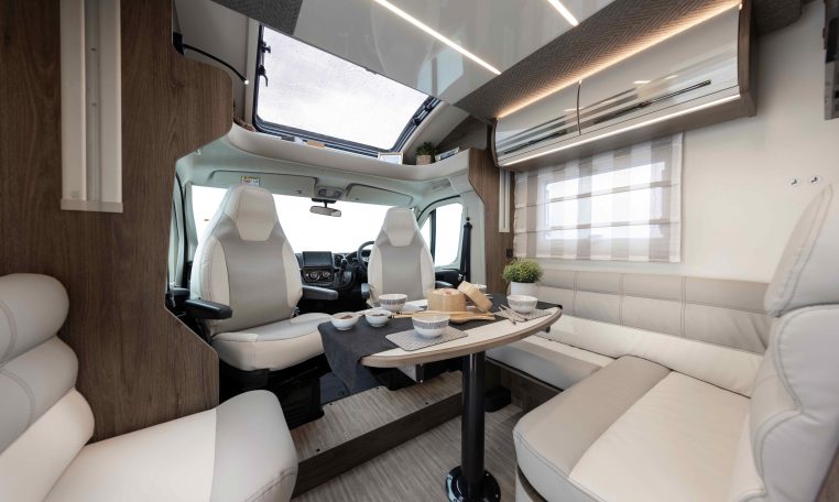 2026 Roller Team T-Line 700 interior view showing the L-shaped dining.