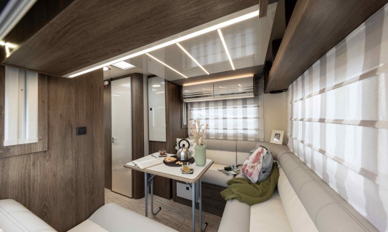 2026 Roller Team T-Line 700 interior view showing the rear lounge blinds.