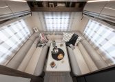2026 Roller Team T-Line 700 interior view showing the rear lounge overhead storage.