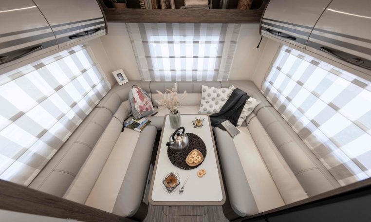 2026 Roller Team T-Line 700 interior view showing the rear lounge overhead storage.
