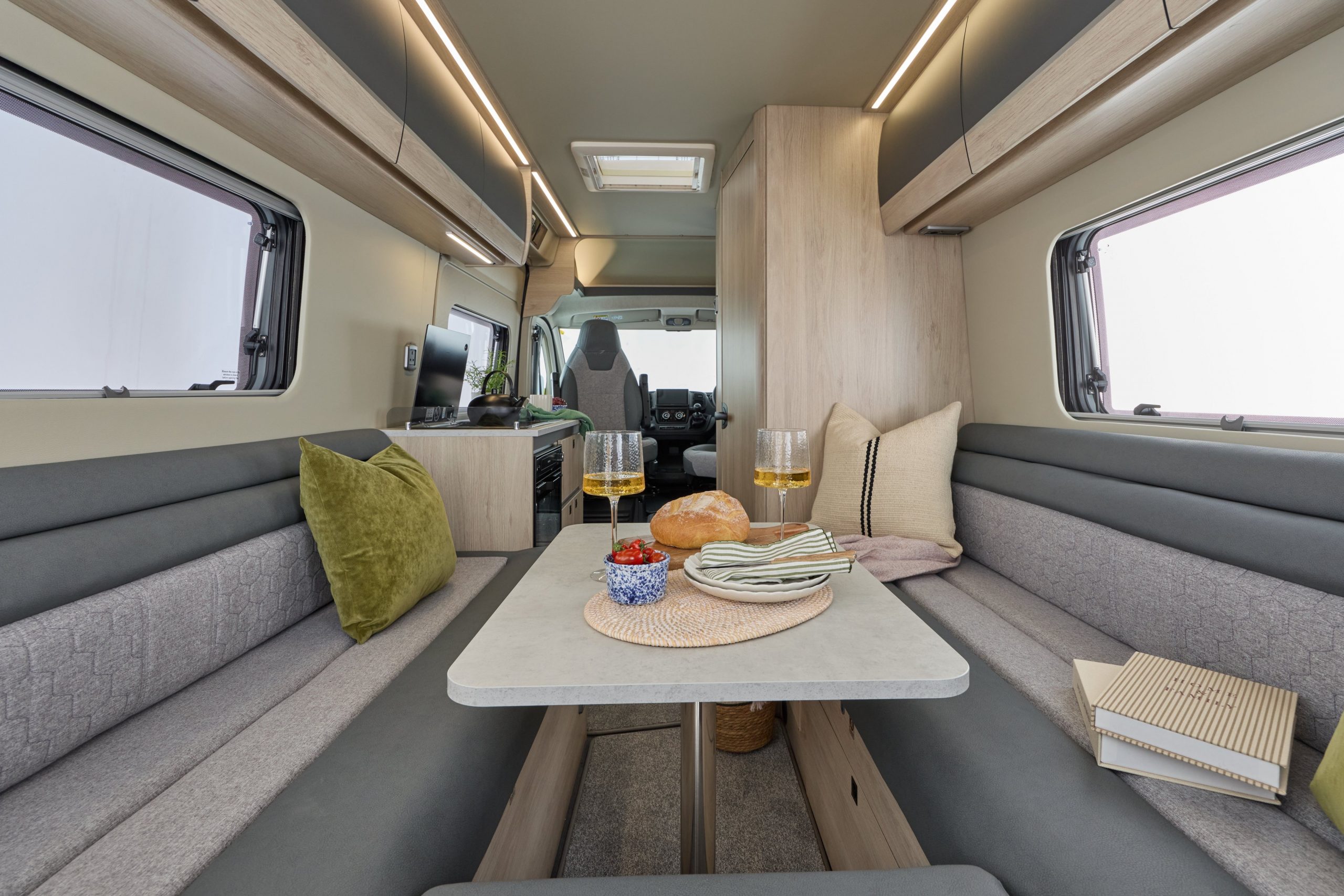 2026 – Auto-Trail – Expedition – 66 – Interior Lounge Dining Back Facing 2026 Auto-Trail Expedition Van lounge and bed area
