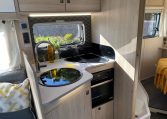 2023 Auto-Trail F-Line F74 motorhome interior view showing the kitchen with an oven and hob.