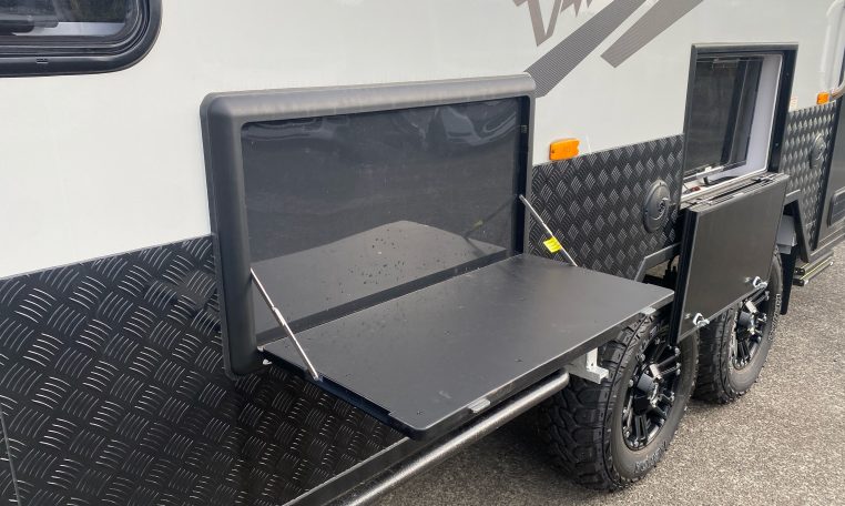 2024 Titan Blackhawk Tourer 720 Tardis caravan exterior view showing the mud tyres.