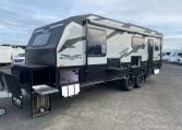 2024 Titan Blackhawk Tourer 720 Tardis caravan exterior view showing the picnic table unit.