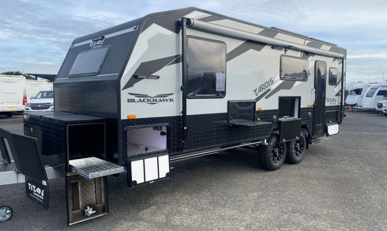 2024 Titan Blackhawk Tourer 720 Tardis caravan exterior view showing the picnic table unit.