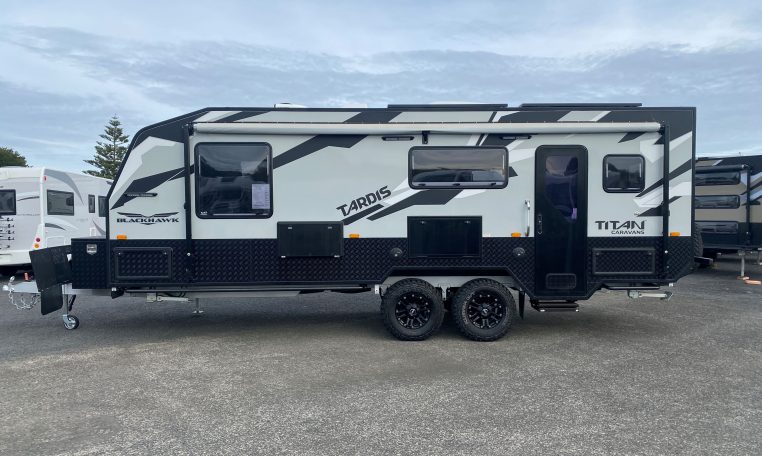 Exterior side profile of the 2024 Titan Blackhawk Tourer 720 caravan showing the windows and habitation door.