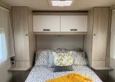 2023 Auto-Trail F-Line F74 motorhome interior view showing the bedroom overhead storage.