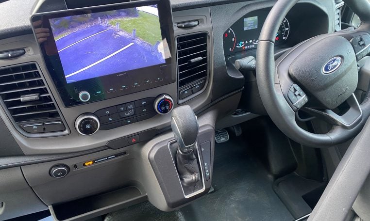 2023 Auto-Trail F-Line F74 motorhome interior view showing the front cab steering wheel.