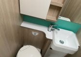 2023 Auto-Trail F-Line F74 motorhome interior view showing the bathroom with separate toilet and handbasin.