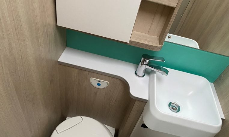 2023 Auto-Trail F-Line F74 motorhome interior view showing the bathroom with separate toilet and handbasin.