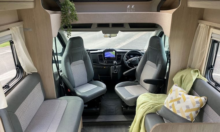 2023 Auto-Trail F-Line F74 motorhome interior view showing the front lounge with cab swivel seats.